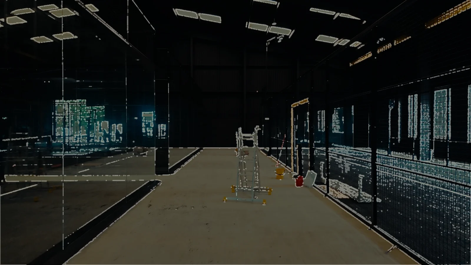 An indoor padel court with its glass up and its floor down, the lights still low.